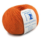 This is a smallish ball of yarn with thin strings. It is wound in a circle and looks soft to touch. It is about four to six inches around. This ball is orange, if that helps.